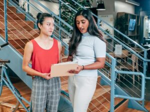 Co-workers in the office (Complimentary Job Description Resources blog)