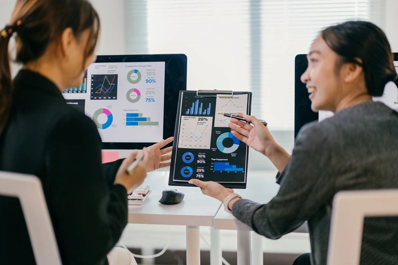 Team Utilizing Data Management Skills To Analyze Analytics And Propel Business Decisions