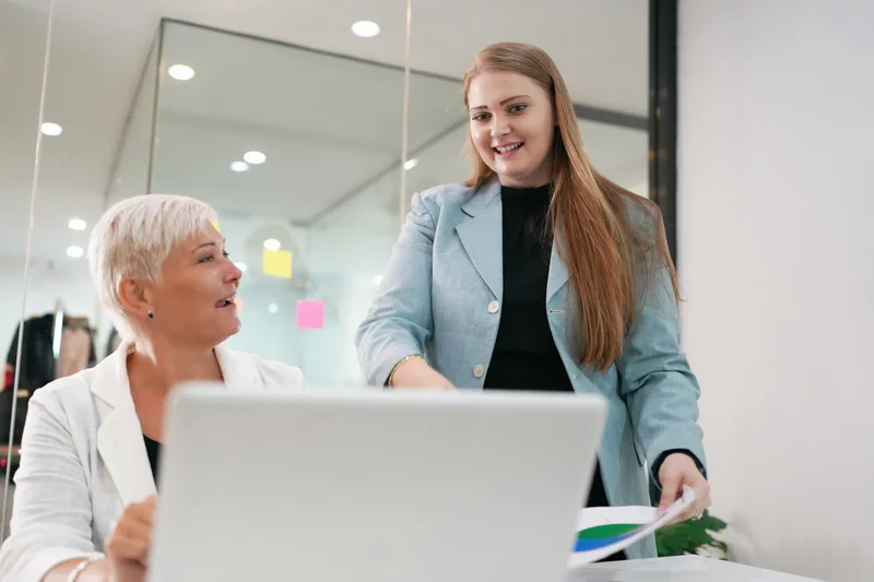 Administrative Assistant Demonstrating Clerical Experience By Assisting Colleague