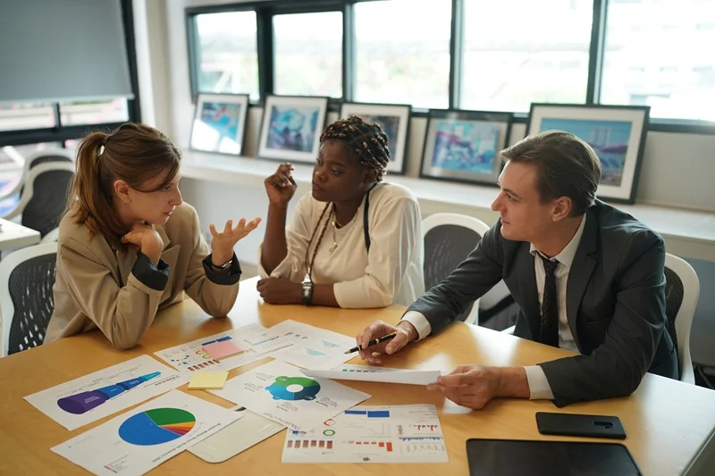 Team Showcasing The Risk Management Skills In A Management Meeting