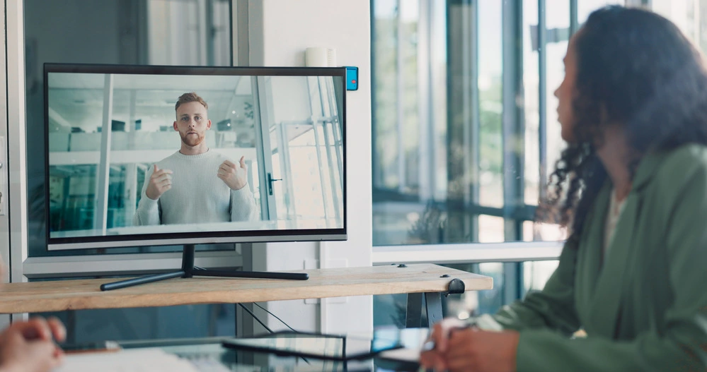 An Applicant Wearing Business Casual Interview Attire During Virtual Interview