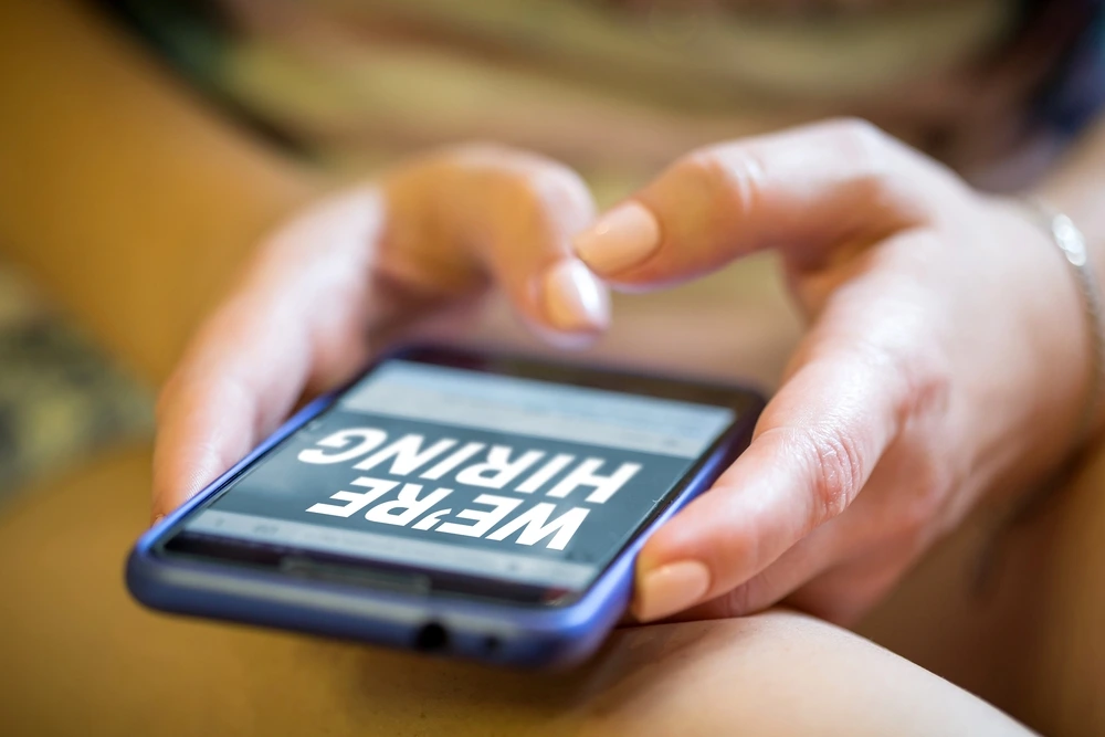 A Job Opening Posting Displayed On A Mobile Screen, Illustrating Companies Committed To Fair Chance Hiring And Offering Jobs That Don't Require Background Checks.